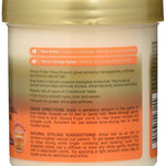 Back of a hair care product container with text and branding