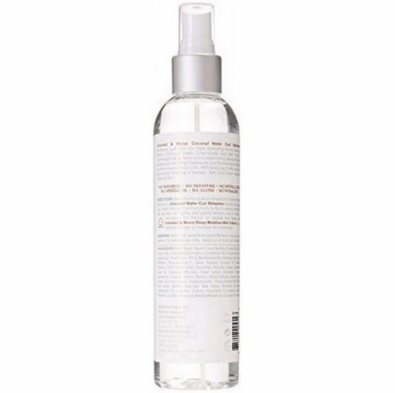 Clear spray bottle with label on a white background