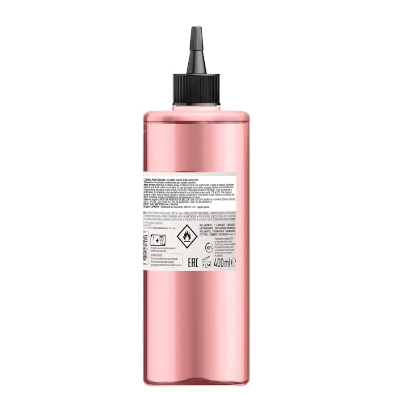 Pink bottle with black cap on a white background