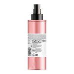 Pink spray bottle with black nozzle on a white background