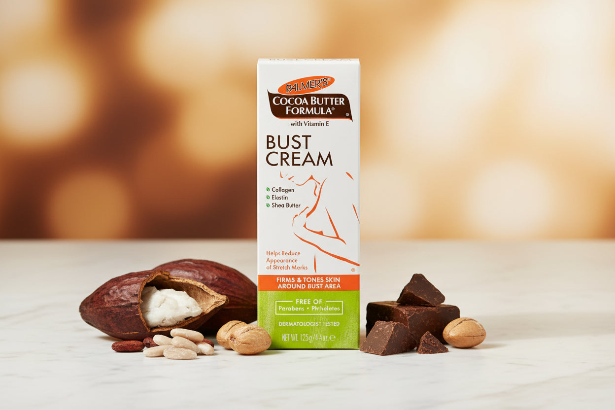 A tall rectangular box of Palmers Cocoa Butter Formula Bust Cream on a plain white background. The packaging is primarily white with orange, brown, and green sections, featuring product text and a line drawing of a female bust.