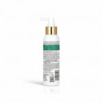 A white pump bottle of hair product with a metallic gold collar and a white applicator nozzle, shown from the back to display the text label. The label features a green band with product information.