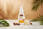 A 400 ml white pump bottle of Palmer's Shea Butter Formula Raw Shea Nourish Daily Body Lotion, featuring a white label with orange and brown accents, set against a plain white background.