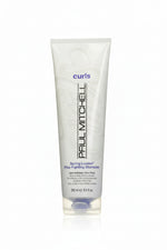 Paul Mitchell shampoo bottle with 'curls' branding on a white background