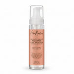 A pump bottle of Shea Moisture Coconut & Hibiscus Frizz Free Curl Mousse.