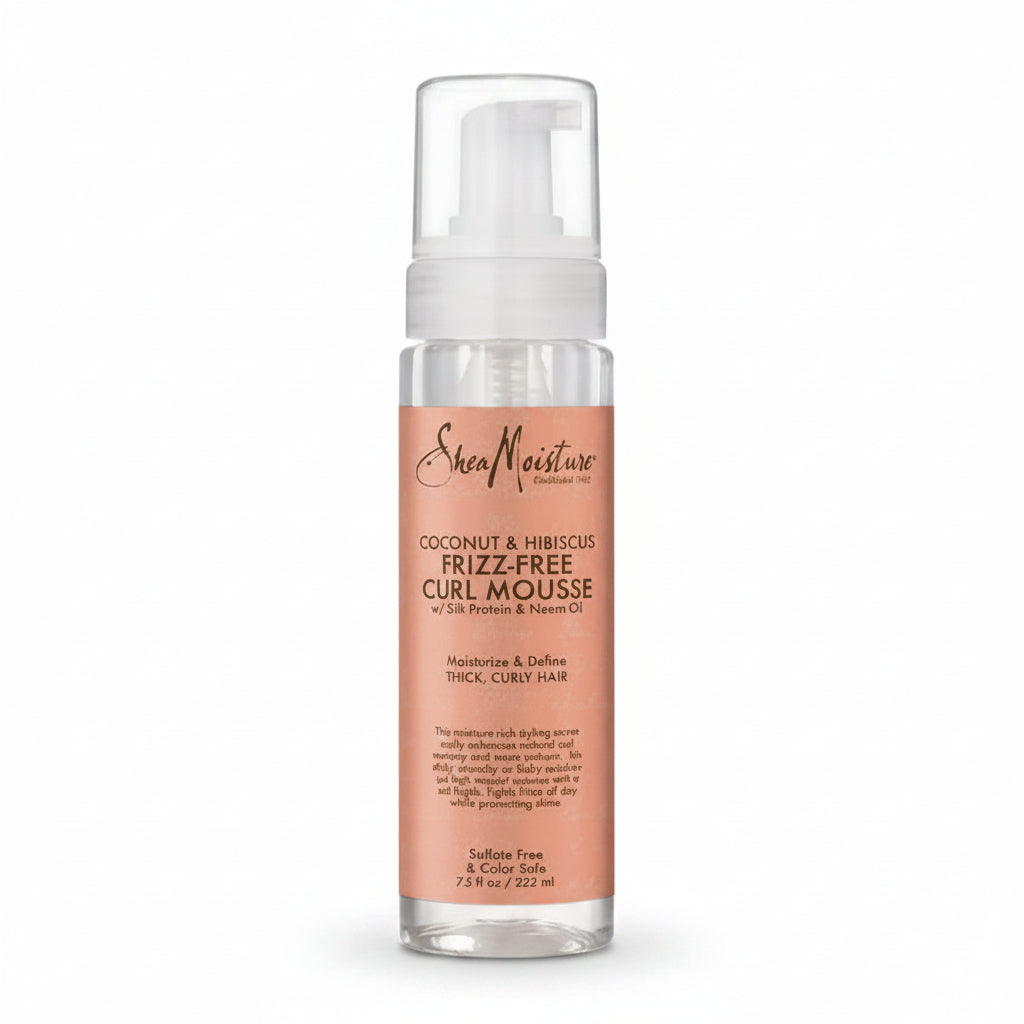 A pump bottle of Shea Moisture Coconut & Hibiscus Frizz Free Curl Mousse.