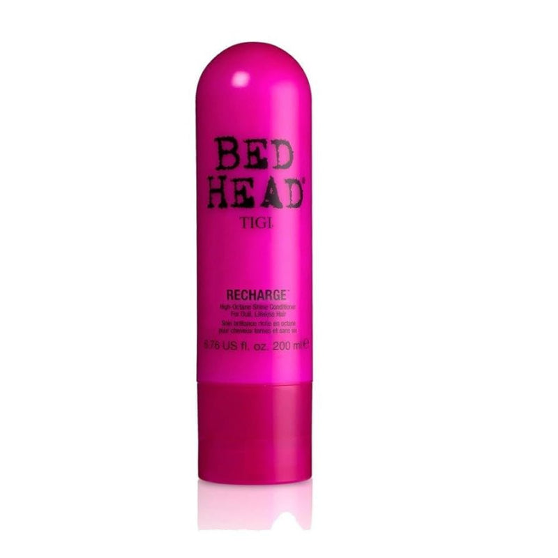 Pink bottle of TIGI Bed Head Recharge hair product on a white background