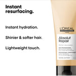 L'Oreal Absolut Repair conditioner bottle with product benefits text on a white background