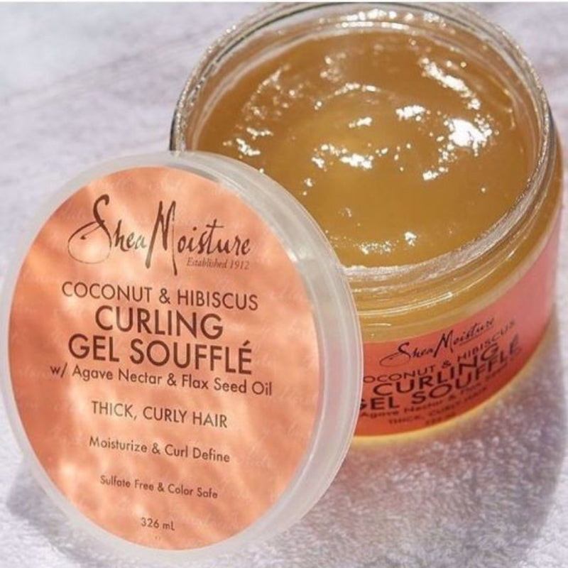 Jar of Shea Moisture coconut and hibiscus curling gel souffle with pink label.
